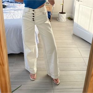 white zara jeans with brown stitching